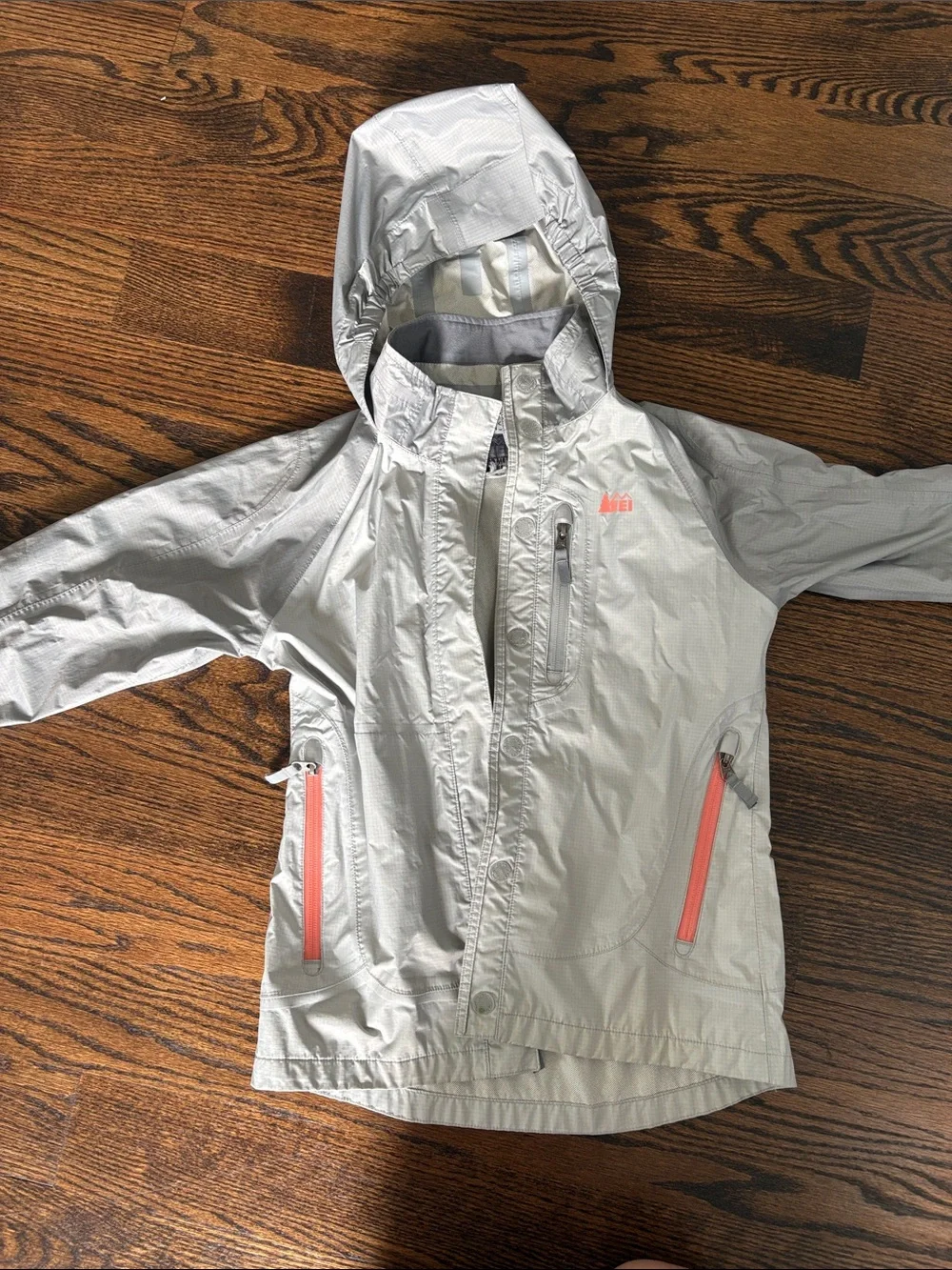 REI Kids Hooded Rain Jacket in Light Gray with Coral Accents